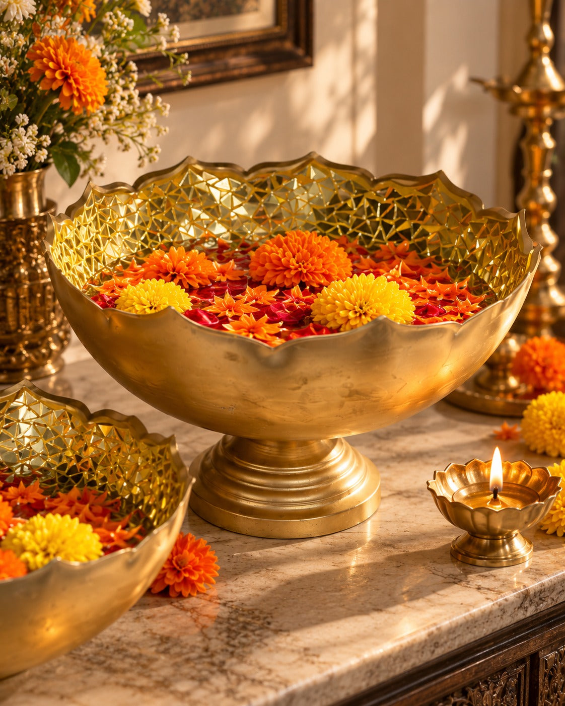 Large gold-tone bowl with a scalloped rim, faceted interior, and pedestal base