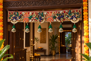 Mayur Kesari peacock and lotus toran styled on a carved wooden doorway