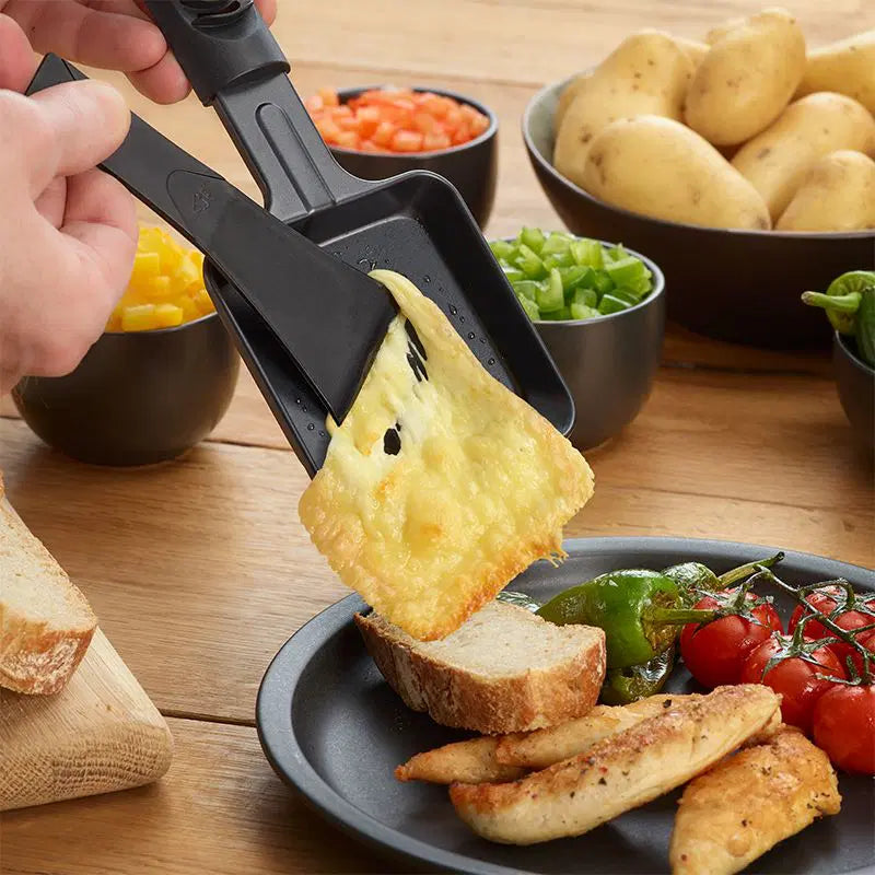 Load video: Raclette cheese maker grill with tealight candles